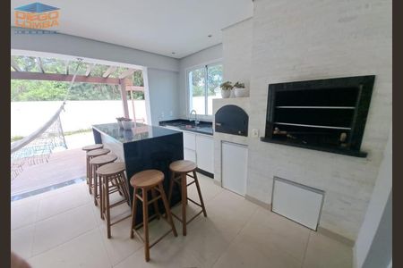 34_photo/9527439cd5.ae6c0d4ae2e822c2-ATLAS-ff2ca569-d737-4f12-a3a0-1b9ae55b969d.jpg de casa à venda com 4 quartos, 227m² em Canasvieiras, Florianópolis