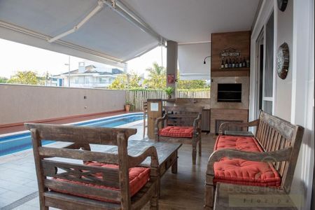 18_photo/952744689f.12a796eb49bed496-ATLAS-c2b0e0be-67f0-4ecb-8d24-e113bbb6aaa9.jpg de casa à venda com 5 quartos, 436m² em Jurerê Internacional, Florianópolis