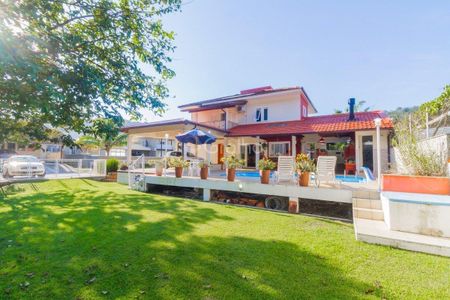 32_photo/9527467b7d.f469cfda097b0aa9-ATLAS-a0882dd1-2c78-4b33-b282-7d1a510edca7.jpg de casa à venda com 4 quartos, 278m² em Sambaqui, Florianópolis