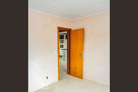 Dormitório de casa à venda com 3 quartos, 100m² em Vila Nova, Porto Alegre