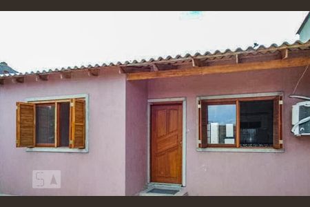 Fachada de casa à venda com 3 quartos, 100m² em Vila Nova, Porto Alegre