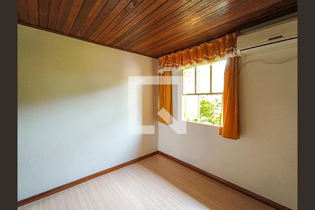 Quarto 1 de casa de condomínio para alugar com 2 quartos, 48m² em Vila Nova, Porto Alegre