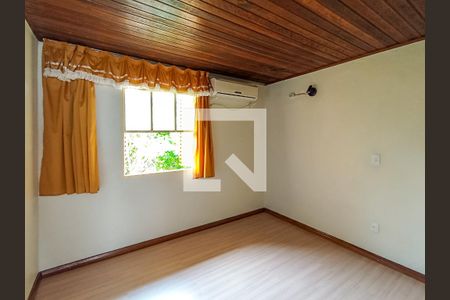 Quarto 1 de casa de condomínio para alugar com 2 quartos, 48m² em Vila Nova, Porto Alegre