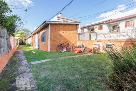 Fachada de casa de condomínio à venda com 1 quarto, 40m² em São José, Porto Alegre