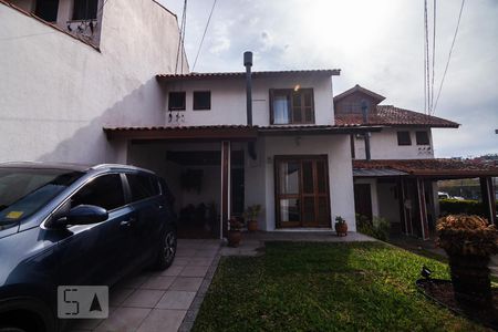 Fachada de casa de condomínio à venda com 3 quartos, 183m² em Vila Nova, Porto Alegre