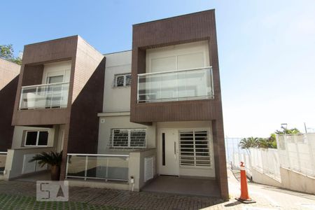 Fachada de casa de condomínio à venda com 3 quartos, 257m² em Praia de Belas, Porto Alegre