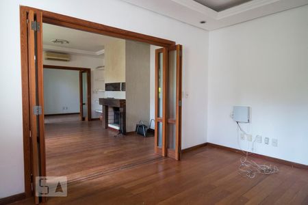 Sala de TV de casa à venda com 3 quartos, 220m² em Ipanema, Porto Alegre