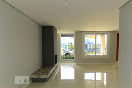 Sala de casa de condomínio à venda com 3 quartos, 140m² em Campo Novo, Porto Alegre