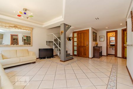 Sala de casa de condomínio à venda com 3 quartos, 300m² em Vila Nova, Porto Alegre