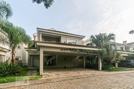 Casa de condomínio à venda com 407m², 4 quartos e 3 vagas Casa de condomínio à venda com 407m², 4 quartos e 3 vagasFachada