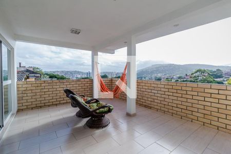 Varanda de casa à venda com 3 quartos, 400m² em Partenon, Porto Alegre