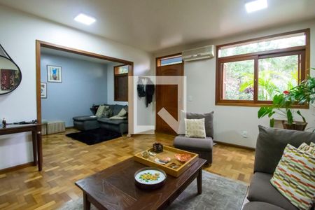 Sala de Estar de casa de condomínio à venda com 3 quartos, 150m² em Vila Nova, Porto Alegre