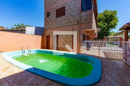 Piscina  de casa à venda com 5 quartos, 250m² em Rio Branco, Canoas