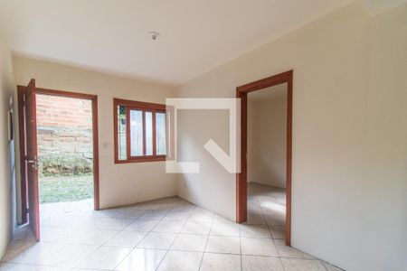 Sala de casa de condomínio para alugar com 1 quarto, 42m² em Vila Nova, Porto Alegre