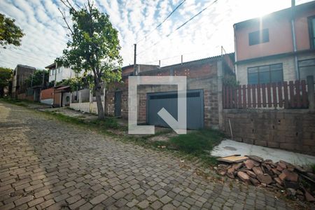 Fachada de casa à venda com 3 quartos, 98m² em Vila Nova, Porto Alegre