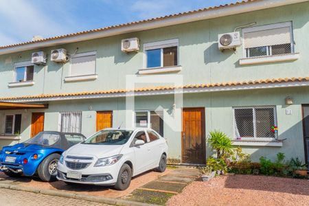 Fachada de casa de condomínio à venda com 2 quartos, 97m² em Hípica, Porto Alegre