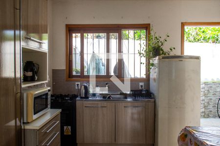 Cozinha  de casa de condomínio à venda com 1 quarto, 32m² em Guarujá, Porto Alegre