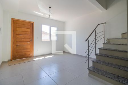 Sala de casa de condomínio à venda com 2 quartos, 60m² em Vila Nova, Porto Alegre