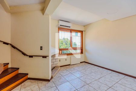 Sala de casa de condomínio à venda com 3 quartos, 188m² em Espírito Santo, Porto Alegre