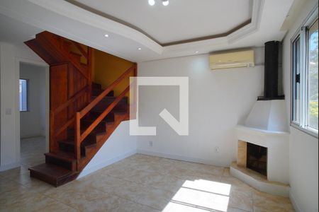 Sala de casa de condomínio à venda com 3 quartos, 87m² em Humaitá, Porto Alegre