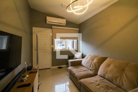 Sala de casa de condomínio à venda com 2 quartos, 72m² em Harmonia, Canoas