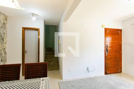 Sala de casa de condomínio à venda com 3 quartos, 100m² em Harmonia, Canoas