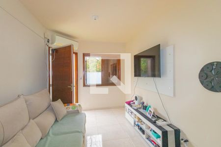 Sala de casa de condomínio à venda com 2 quartos, 42m² em Harmonia, Canoas