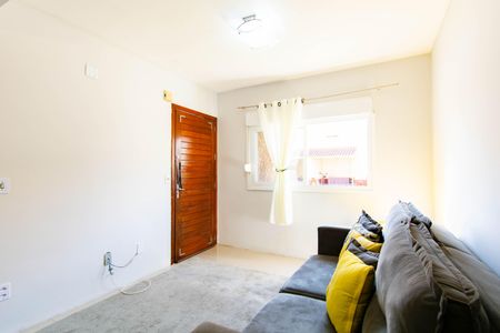 Sala de casa de condomínio à venda com 3 quartos, 100m² em Harmonia, Canoas