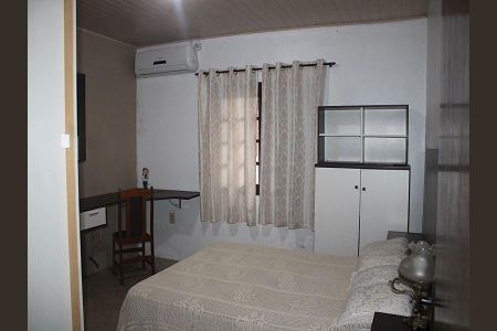 Quarto 1 de casa à venda com 3 quartos, 180m² em Costa E Silva, Porto Alegre