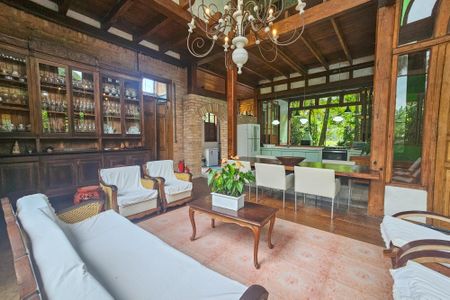 Sala de casa de condomínio para alugar com 4 quartos, 400m² em Vila Santo Antônio, Guarujá