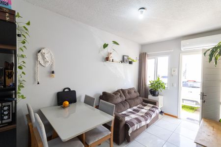 Sala de casa de condomínio à venda com 2 quartos, 49m² em Restinga, Porto Alegre